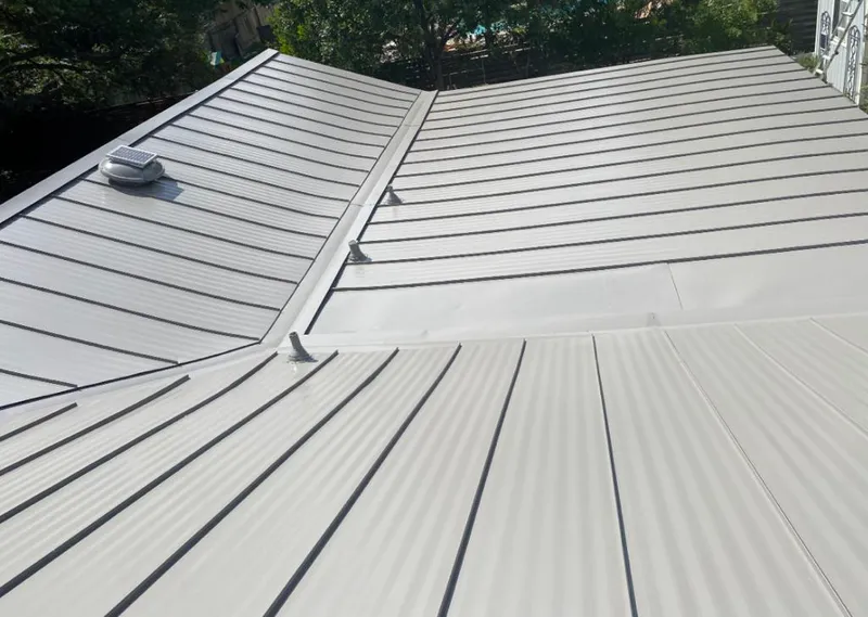 Solar attic fan installed on a metal roof for Roof Ventilation in Falls Church